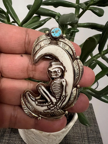 Hand carved crescent - carved, skull
